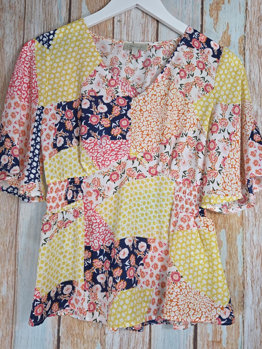 Chenault Patchwork Floral Peplum Top in Yellow, Navy & Pink. Size PS